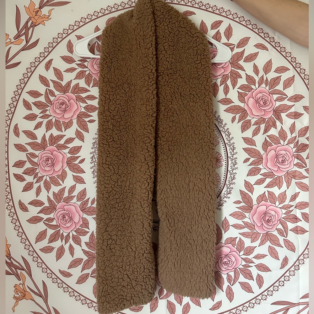 A nice fuzzy, warm, tan scarf.